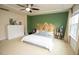 Spacious primary bedroom with a wood headboard and windows at 248 Begen St, Morrisville, NC 27560