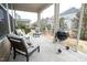 A screened patio featuring comfortable seating and a grill at 248 Begen St, Morrisville, NC 27560