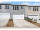 Exterior shot of townhome community with individual garages and well-maintained landscaping at 277 Chesapeake Commons St # 94, Garner, NC 27529