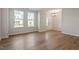 Bright living room with hardwood floors, modern chandelier, and lots of natural light at 277 Chesapeake Commons St # 94, Garner, NC 27529
