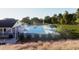 The community pool boasts abundant seating, umbrellas, and a sun-soaked deck at 277 Chesapeake Commons St # 94, Garner, NC 27529