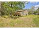 Spacious backyard featuring a wooden deck and partially wooded perimeter at 2857 Greenbrook Dr, Wendell, NC 27591