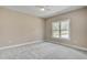 A bedroom featuring a window, neutral paint, and carpet flooring creating a bright and inviting space at 2857 Greenbrook Dr, Wendell, NC 27591