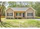 Charming single-story home with blue shutters, light siding, and a welcoming front porch at 2857 Greenbrook Dr, Wendell, NC 27591