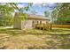 The home's exterior features a back deck and neutral siding, blending seamlessly with the landscape at 2857 Greenbrook Dr, Wendell, NC 27591