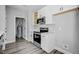 Modern kitchen with white cabinets, stainless steel appliances, and quartz countertops at 2857 Greenbrook Dr, Wendell, NC 27591