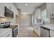 Updated kitchen features stainless steel appliances, white cabinets and an open view at 2857 Greenbrook Dr, Wendell, NC 27591