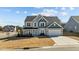 Two-story home with gray siding and a double garage at 320 Shore Pine Dr, Youngsville, NC 27596