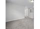 Hallway with neutral walls and plush carpet for comfort and style at 34 Fairwinds Dr, Lillington, NC 27546