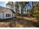 Large backyard offering ample space, a detached shed, and room for outdoor activities at 404 Andrews Rd, Durham, NC 27705