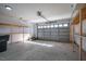 Spacious two-car garage with shelving, an automatic door, and concrete flooring at 404 Andrews Rd, Durham, NC 27705