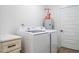 This laundry room features modern machines, storage, and plenty of light at 404 Andrews Rd, Durham, NC 27705