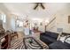 Open-concept living space with hardwood floors, a comfortable seating area, and seamless transition to the kitchen and dining area at 404 Andrews Rd, Durham, NC 27705
