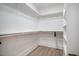 This walk-in closet boasts ample storage space and built-in shelving at 404 Andrews Rd, Durham, NC 27705