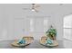 Kitchen island with seating area and light-filled dining space at 408 W Hill S Ave, Hillsborough, NC 27278