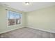 Simple bedroom with a large window and neutral walls at 421 Shady Willow Ln, Rolesville, NC 27571