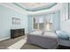 Relaxing bedroom with light blue walls and a ceiling fan at 421 Shady Willow Ln, Rolesville, NC 27571