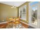 Kitchen dining area with table and chairs near sliding glass door at 421 Shady Willow Ln, Rolesville, NC 27571