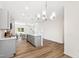 Open concept kitchen with gray cabinets and island at 435 Iris Bryant Rd, Dunn, NC 28334