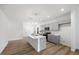 Modern kitchen with island, gray cabinets and stainless steel appliances at 435 Iris Bryant Rd, Dunn, NC 28334