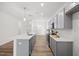 Modern kitchen with gray cabinets, white countertops, and an island at 435 Iris Bryant Rd, Dunn, NC 28334