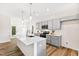 Modern kitchen with island, gray cabinets, and stainless steel appliances at 435 Iris Bryant Rd, Dunn, NC 28334