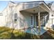 Covered back patio with access from sliding glass doors at 5016 Parkerwood Dr, Knightdale, NC 27545
