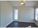 Sunlit dining area with dark floors and access to the outdoors at 5016 Parkerwood Dr, Knightdale, NC 27545