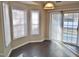 Dining area with bay window, sliding glass door to patio and hardwood floors at 5016 Parkerwood Dr, Knightdale, NC 27545
