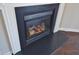 Gas fireplace with a white mantel and dark hearth at 5016 Parkerwood Dr, Knightdale, NC 27545