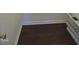 Dark hardwood floors in a clean and bright hallway at 5016 Parkerwood Dr, Knightdale, NC 27545