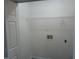 White laundry room with washer/dryer hookups and shelving at 5016 Parkerwood Dr, Knightdale, NC 27545