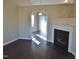 Living room with hardwood floors, a fireplace, and views to other rooms at 5016 Parkerwood Dr, Knightdale, NC 27545