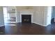 Living room with a fireplace and dark hardwood floors at 5016 Parkerwood Dr, Knightdale, NC 27545