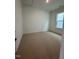 Cozy bedroom with plush carpeting and a bright window at 524 Gainer Dr # 7, Raleigh, NC 27610