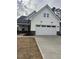 Beautiful single-Gathering home with a two-car garage and a modern farmhouse exterior at 524 Gainer Dr # 7, Raleigh, NC 27610