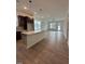 Open concept kitchen featuring an eat-in island and modern pendant lighting at 524 Gainer Dr # 7, Raleigh, NC 27610