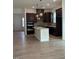 Modern kitchen with granite countertops, dark cabinets and hardwood floors at 524 Gainer Dr # 7, Raleigh, NC 27610
