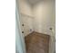 Functional laundry room with wood-look flooring and a wire shelf at 524 Gainer Dr # 7, Raleigh, NC 27610