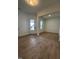 A spacious living room featuring durable wood flooring, neutral colors, and bright recessed lighting at 524 Gainer Dr # 7, Raleigh, NC 27610
