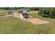 New construction aerial shot showing white siding, black roof, and spacious lot at 5377 River Buck Rd, Spring Hope, NC 27882