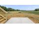 Concrete patio overlooking a large, grassy backyard at 5377 River Buck Rd, Spring Hope, NC 27882