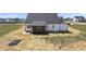 Picture of new construction farmhouse backyard with a covered back porch at 5377 River Buck Rd, Spring Hope, NC 27882