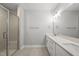 Elegant bathroom with a glass-enclosed shower, double sinks, and a bright, modern design at 5377 River Buck Rd, Spring Hope, NC 27882