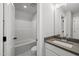 Bathroom featuring modern vanity, sink and faucet, and separate area with tub and toilet at 5377 River Buck Rd, Spring Hope, NC 27882