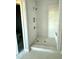 Modern walk-in shower with tiled walls, shower head, built-in seat, and tile flooring at 5377 River Buck Rd, Spring Hope, NC 27882
