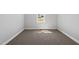 Cozy bedroom with plush carpeting and a window offering natural light, creating a serene atmosphere at 5377 River Buck Rd, Spring Hope, NC 27882