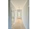 Bright entryway featuring neutral walls, chandelier, and a door with glass detailing at 5377 River Buck Rd, Spring Hope, NC 27882