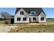 Charming new build features white siding, black shutters and a welcoming front porch at 5377 River Buck Rd, Spring Hope, NC 27882