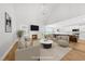 Bright, open-concept living room with fireplace, and hardwood floors at 5377 River Buck Rd, Spring Hope, NC 27882